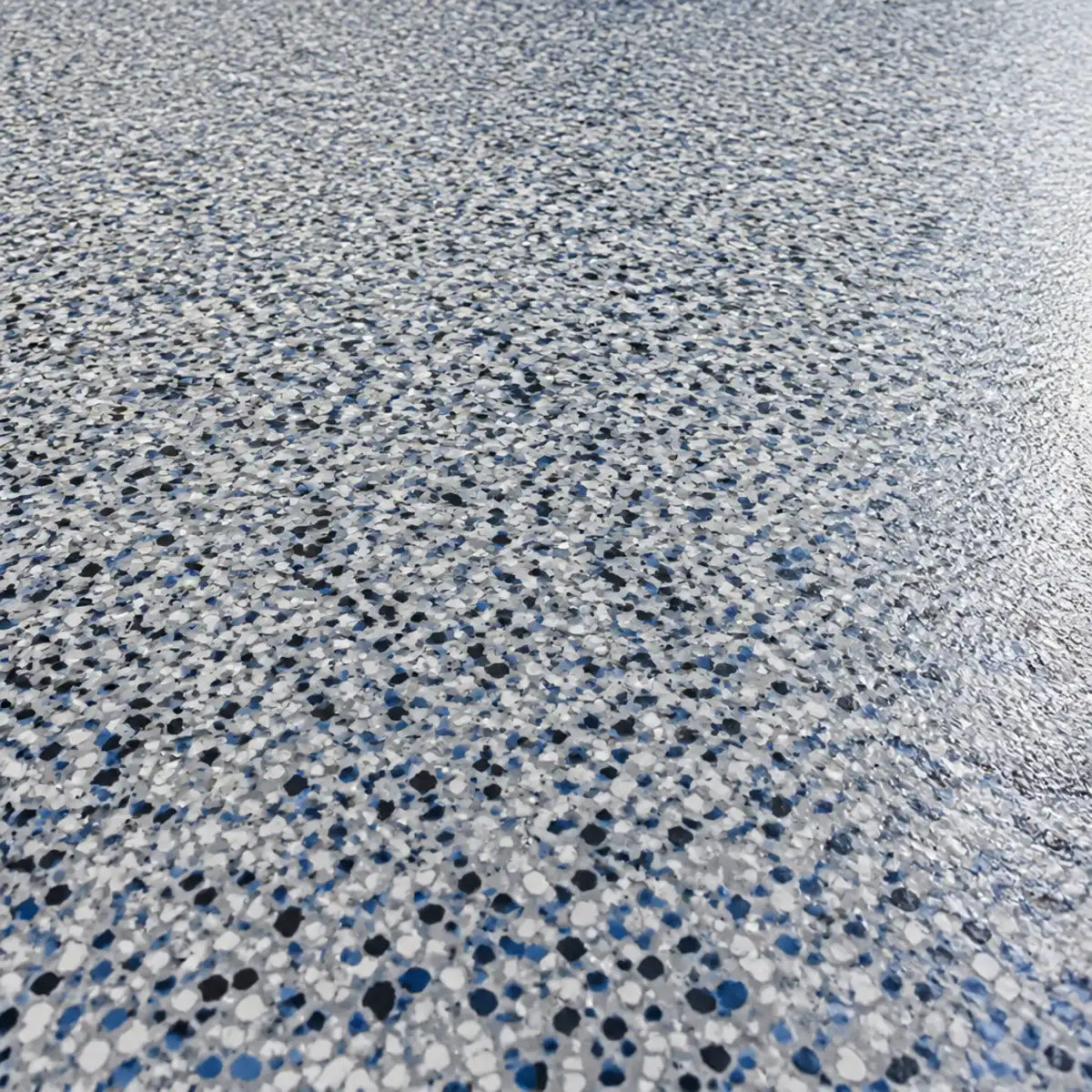 Custom flake epoxy color blend under a glossy clearcoat