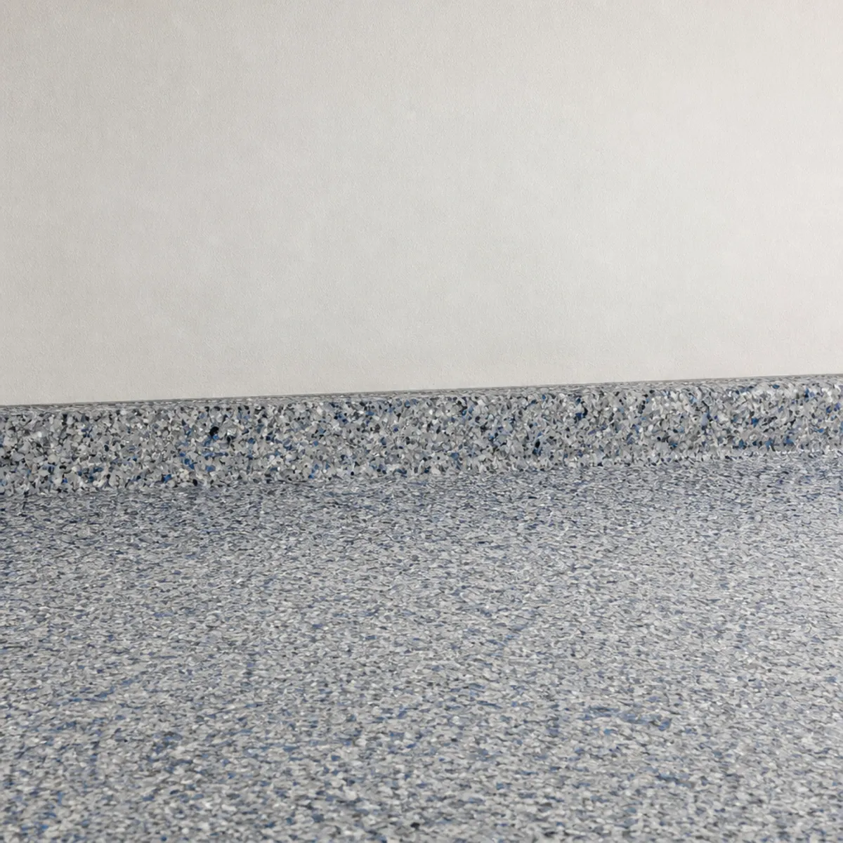 Clean edge detail of a garage floor coating