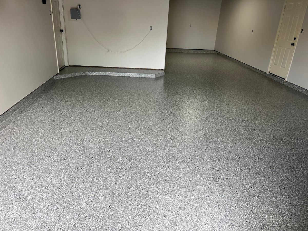 Light gray flake epoxy garage floor in a Texas home