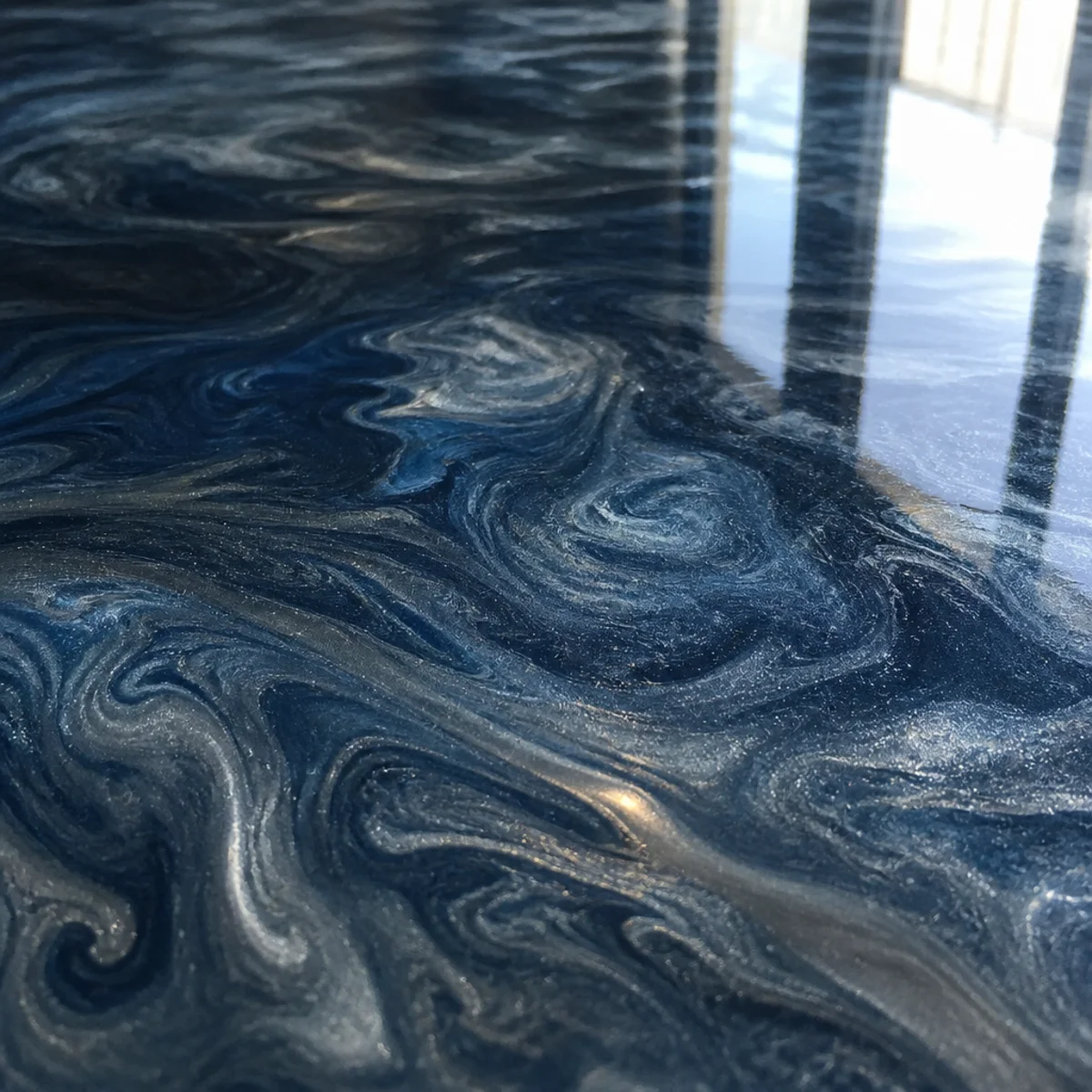 Hand-worked metallic epoxy with swirling pigment